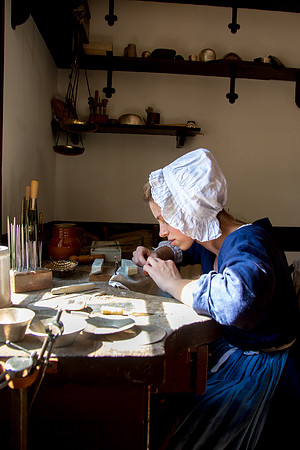 One of the shopkeepers making goods to sell
