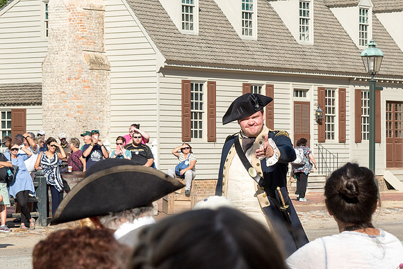 The townspeople debate for all the tourists to hear
